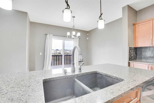 208 Sagewood Landing Sw, Airdrie, AB - Indoor Photo Showing Kitchen With Double Sink With Upgraded Kitchen