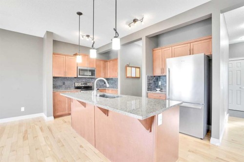 208 Sagewood Landing Sw, Airdrie, AB - Indoor Photo Showing Kitchen With Upgraded Kitchen