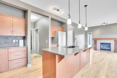 208 Sagewood Landing Sw, Airdrie, AB - Indoor Photo Showing Kitchen With Upgraded Kitchen