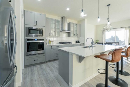 15 Midgrove Drive Sw, Airdrie, AB - Indoor Photo Showing Kitchen With Stainless Steel Kitchen With Double Sink With Upgraded Kitchen
