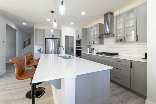 15 Midgrove Drive Sw, Airdrie, AB - Indoor Photo Showing Kitchen With Stainless Steel Kitchen With Double Sink With Upgraded Kitchen