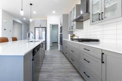 15 Midgrove Drive Sw, Airdrie, AB - Indoor Photo Showing Kitchen With Upgraded Kitchen