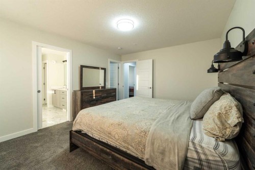 15 Midgrove Drive Sw, Airdrie, AB - Indoor Photo Showing Bedroom