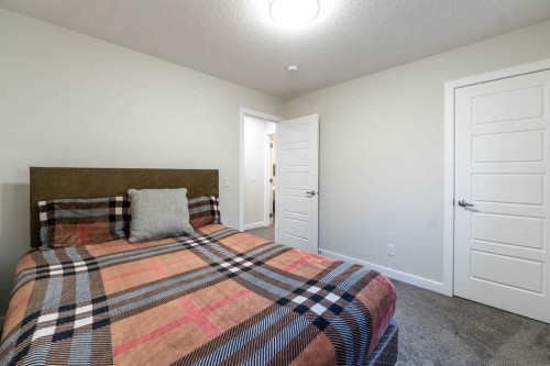 15 Midgrove Drive Sw, Airdrie, AB - Indoor Photo Showing Bedroom