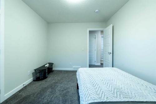 15 Midgrove Drive Sw, Airdrie, AB - Indoor Photo Showing Bedroom