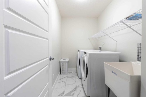 15 Midgrove Drive Sw, Airdrie, AB - Indoor Photo Showing Laundry Room