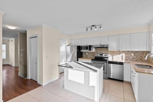 1523 11 Street Sw, Calgary, AB - Indoor Photo Showing Kitchen With Stainless Steel Kitchen With Double Sink With Upgraded Kitchen