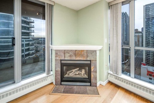 1805-650 10 Street Sw, Calgary, AB - Indoor Photo Showing Living Room With Fireplace