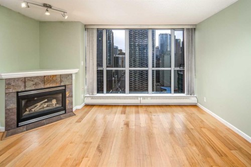 1805-650 10 Street Sw, Calgary, AB - Indoor Photo Showing Living Room With Fireplace
