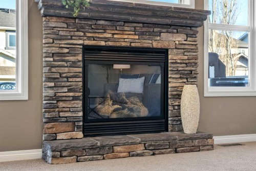 209 New Brighton Lane Se, Calgary, AB - Indoor Photo Showing Living Room With Fireplace