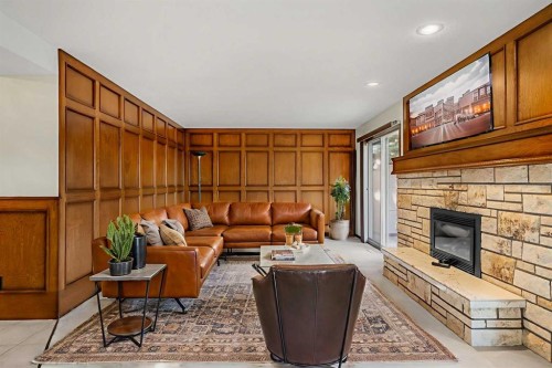720 Parkvalley Road Se, Calgary, AB - Indoor Photo Showing Living Room With Fireplace