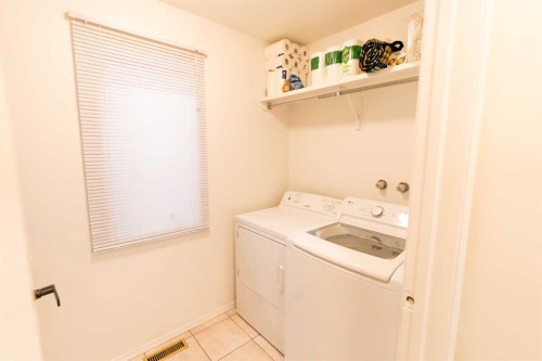 33 Sundown Close Se, Calgary, AB - Indoor Photo Showing Laundry Room