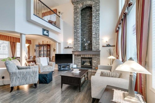 123 Springmere Place, Chestermere, AB - Indoor Photo Showing Living Room With Fireplace