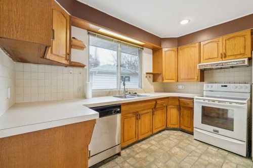 3248 Bearspaw Drive Nw, Calgary, AB - Indoor Photo Showing Kitchen With Double Sink