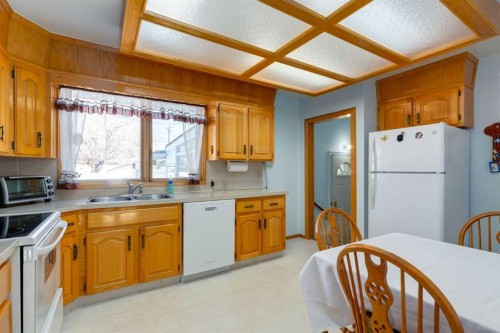 178 Windermere Road Sw, Calgary, AB - Indoor Photo Showing Kitchen With Double Sink