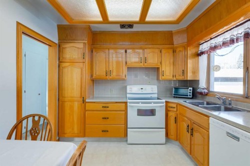 178 Windermere Road Sw, Calgary, AB - Indoor Photo Showing Kitchen With Double Sink