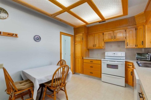 178 Windermere Road Sw, Calgary, AB - Indoor Photo Showing Kitchen With Double Sink