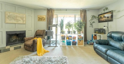 53 Beaconsfield Crescent Nw, Calgary, AB - Indoor Photo Showing Living Room With Fireplace