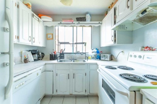 53 Beaconsfield Crescent Nw, Calgary, AB - Indoor Photo Showing Kitchen With Double Sink