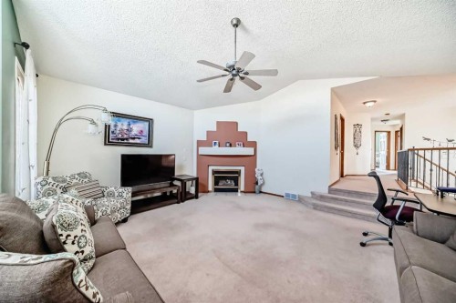 41 Covette Bay Ne, Calgary, AB - Indoor With Fireplace