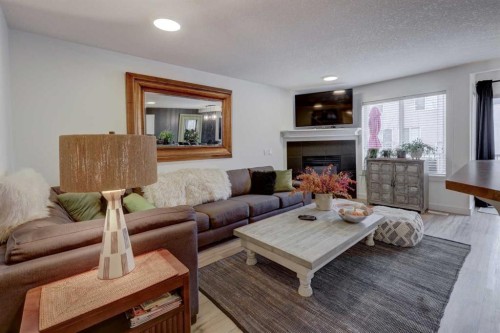 90 Royal Crest Point Nw, Calgary, AB - Indoor Photo Showing Living Room With Fireplace