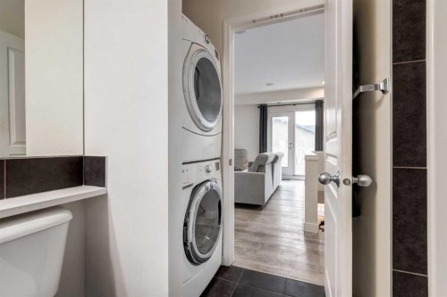 64 Auburn Bay Close Se, Calgary, AB - Indoor Photo Showing Laundry Room