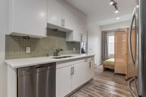 64 Auburn Bay Close Se, Calgary, AB - Indoor Photo Showing Kitchen With Double Sink