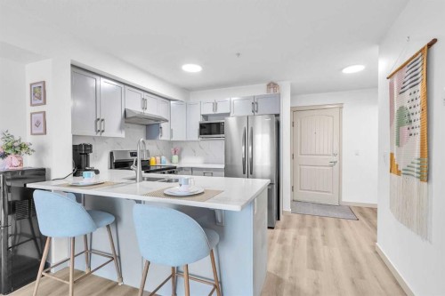 2214-175 Panatella Hill Nw, Calgary, AB - Indoor Photo Showing Kitchen With Stainless Steel Kitchen With Upgraded Kitchen