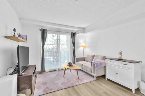 2214-175 Panatella Hill Nw, Calgary, AB - Indoor Photo Showing Living Room