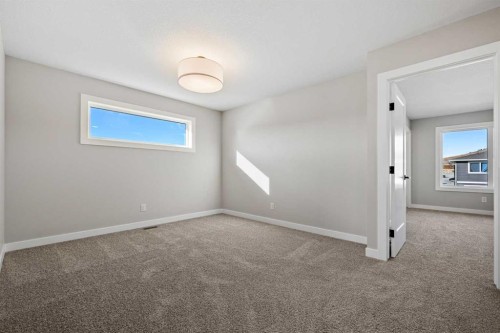 85 Quartz Crescent, Cochrane, AB - Indoor Photo Showing Other Room