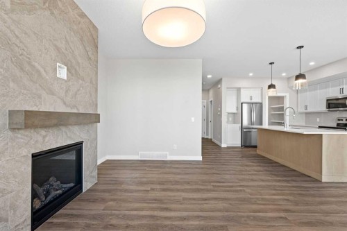85 Quartz Crescent, Cochrane, AB - Indoor With Fireplace