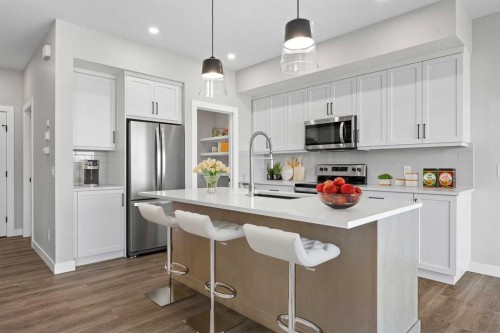 85 Quartz Crescent, Cochrane, AB - Indoor Photo Showing Kitchen With Upgraded Kitchen