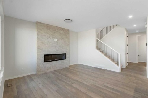 112 Belmont Place Sw, Calgary, AB - Indoor Photo Showing Living Room With Fireplace