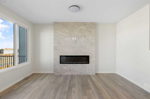 112 Belmont Place Sw, Calgary, AB - Indoor Photo Showing Living Room With Fireplace