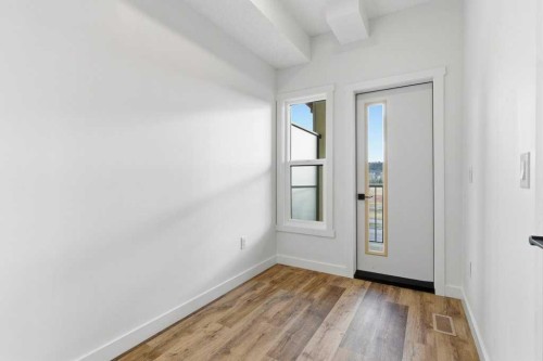 102-156 Park Street, Cochrane, AB - Indoor Photo Showing Other Room