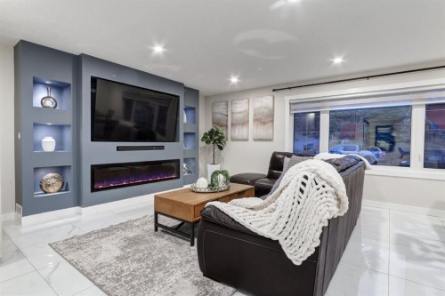 5 Sydney Drive Sw, Calgary, AB - Indoor Photo Showing Living Room With Fireplace