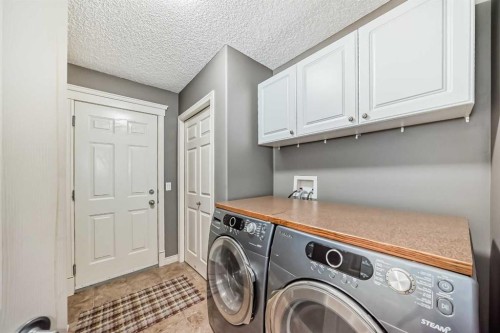 73 Crestmont Drive Sw, Calgary, AB - Indoor Photo Showing Laundry Room