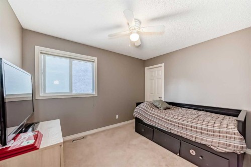 73 Crestmont Drive Sw, Calgary, AB - Indoor Photo Showing Bedroom
