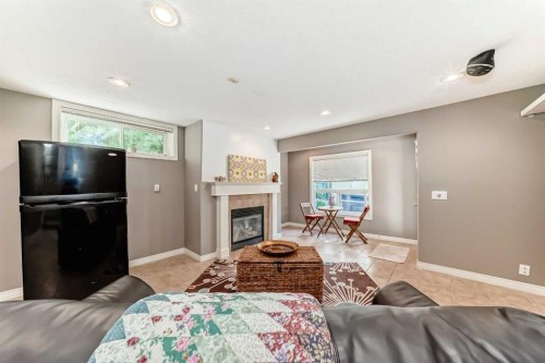 73 Crestmont Drive Sw, Calgary, AB - Indoor Photo Showing Living Room With Fireplace