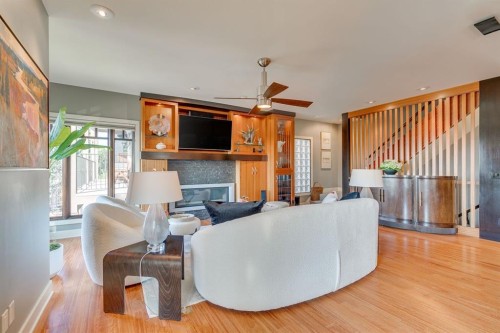 954 Drury Avenue Ne, Calgary, AB - Indoor Photo Showing Other Room With Fireplace