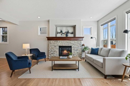 182 Cranarch Place Se, Calgary, AB - Indoor Photo Showing Living Room With Fireplace