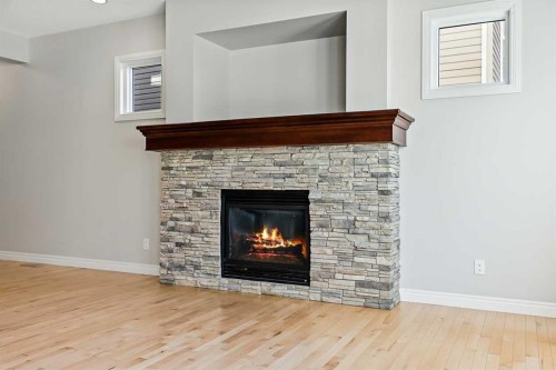182 Cranarch Place Se, Calgary, AB - Indoor Photo Showing Living Room With Fireplace