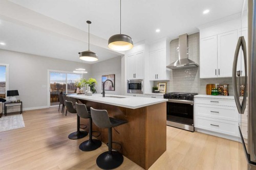 128 Versant Point Sw, Calgary, AB - Indoor Photo Showing Kitchen With Stainless Steel Kitchen With Upgraded Kitchen