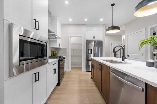 128 Versant Point Sw, Calgary, AB - Indoor Photo Showing Kitchen With Stainless Steel Kitchen With Upgraded Kitchen