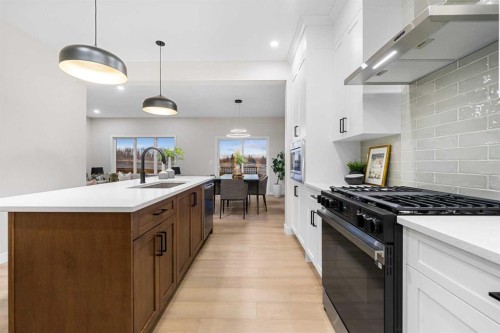 128 Versant Point Sw, Calgary, AB - Indoor Photo Showing Kitchen With Upgraded Kitchen