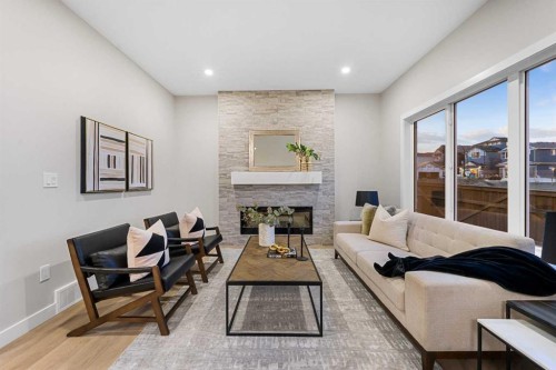 128 Versant Point Sw, Calgary, AB - Indoor With Fireplace