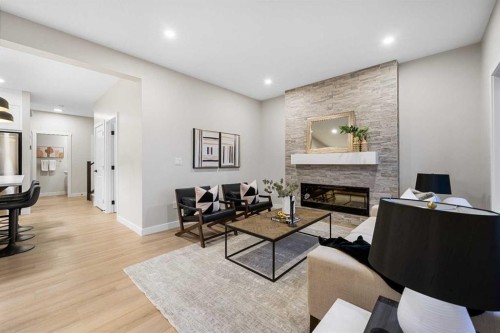 128 Versant Point Sw, Calgary, AB - Indoor Photo Showing Other Room With Fireplace