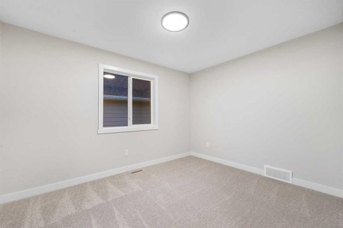 128 Versant Point Sw, Calgary, AB - Indoor Photo Showing Other Room