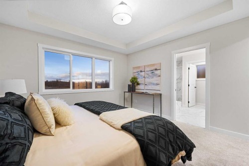 128 Versant Point Sw, Calgary, AB - Indoor Photo Showing Bedroom