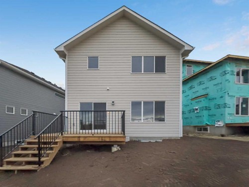 128 Versant Point Sw, Calgary, AB - Outdoor With Deck Patio Veranda With Exterior